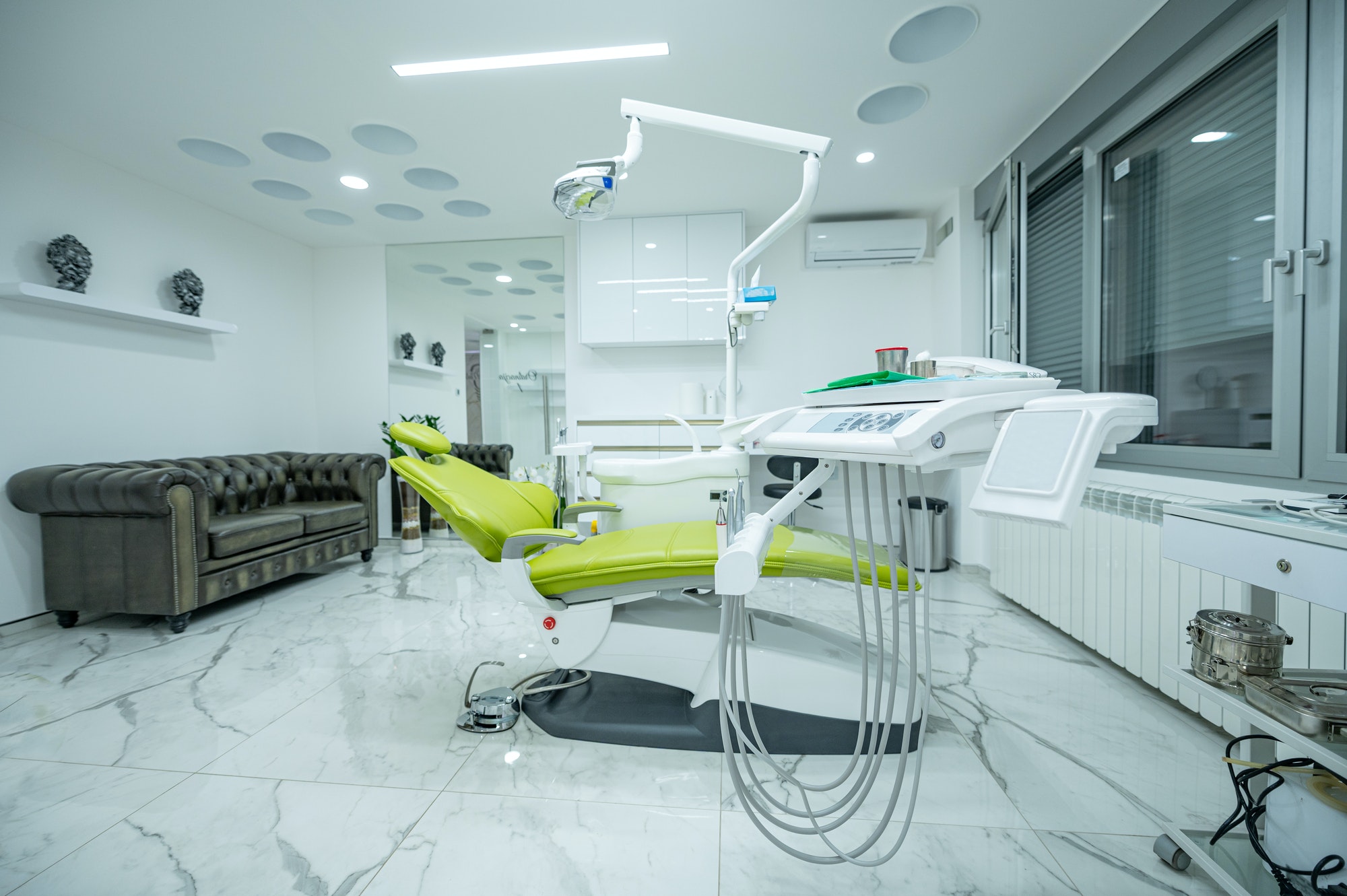 Interior of white modern dentistry medical room with special equipment