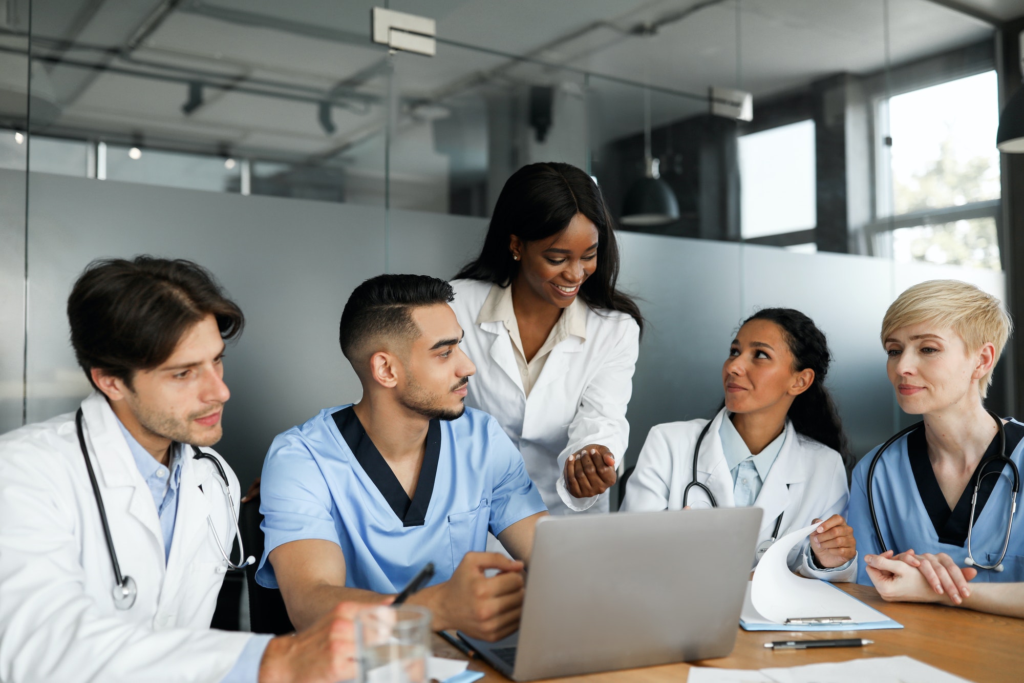 Multiethnic medical staff having morning breefing at clinic